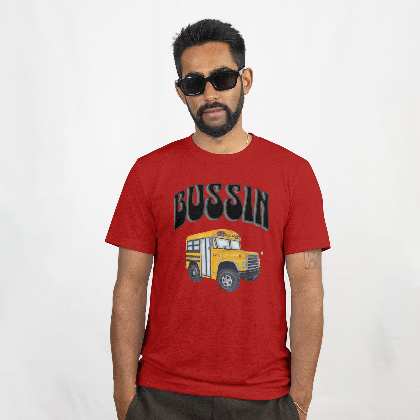 Man wearing a red t-shirt with hand drawn School Bus and text on a white background