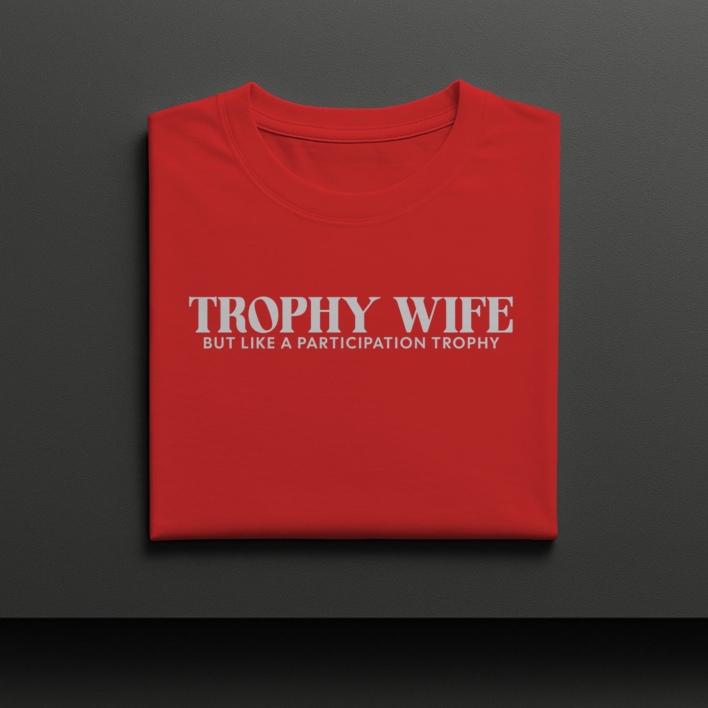 Red t-shirt with 'Trophy Wife' text on a dark gray background