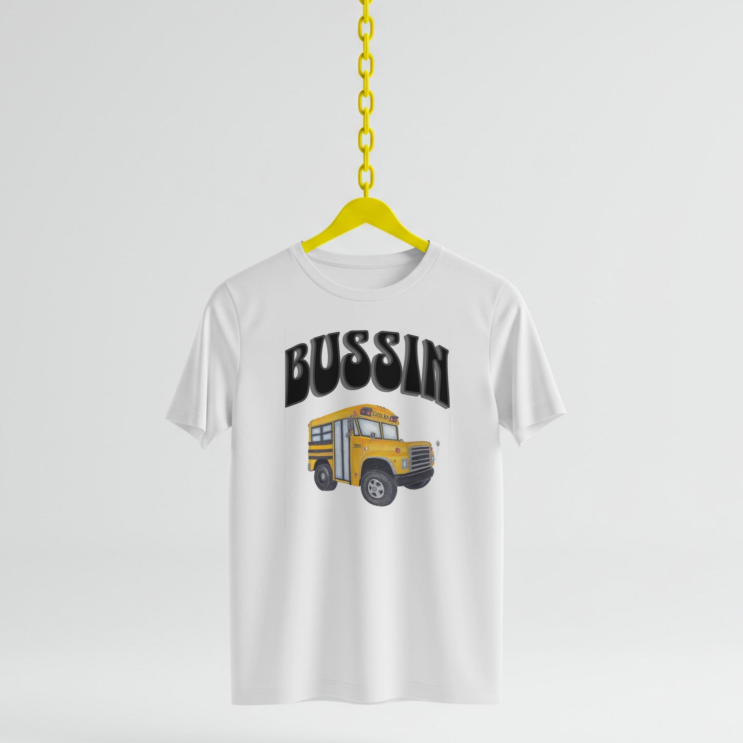 White t-shirt with a graphic of a school bus and the word 'BUSSIN' on a white background.